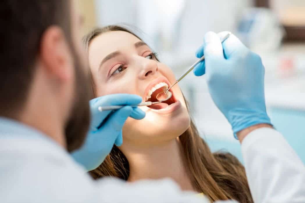 Dental clinician preparing for treatment