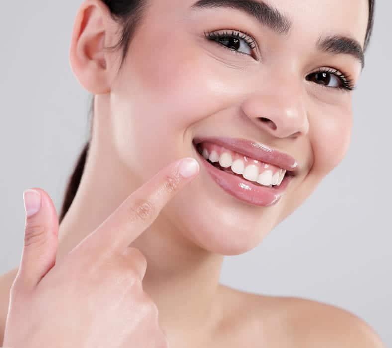 Dental clinician discussing tooth shade with a patient